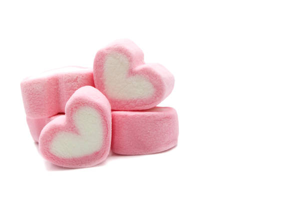 istock Pink sweet heart shape marshmallow isolated on white background. 1220904084