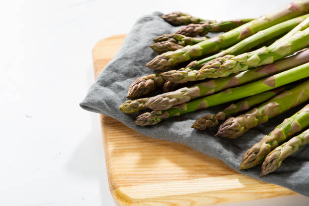 istock Fresh green asparagus close up on cutting board 1220910230