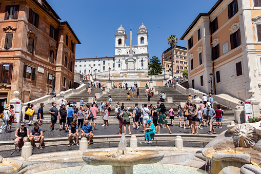 Bologna, Italy - March 05, 2023: People going up the staircase to the Sanctuary of the Blessed Virgin of Saint Luke, also known as 666 Porticos in Bologna, Italy