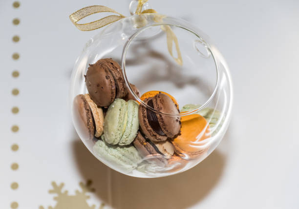 istock Many different colored macaroons in a festive Christmas globe 1220911978