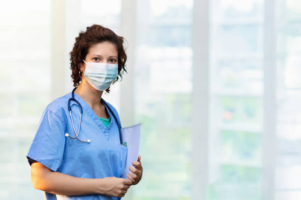 istock Doctor or nurse with stethoscope and face mask. 1220913078