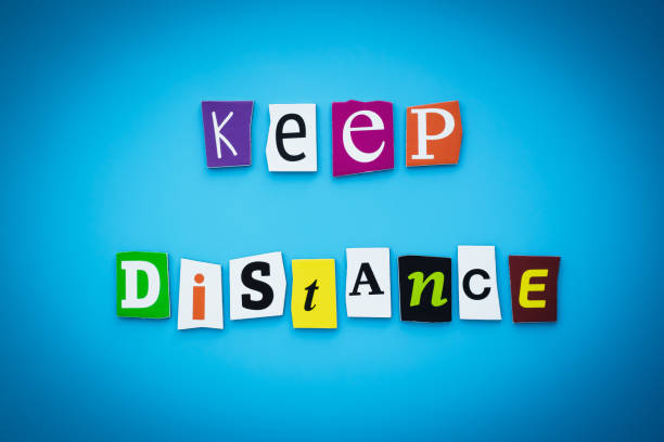 istock A word writing text - keep distance. Helpful advice, cut letters on a blue background. Headline, banner with inscription. Coronavirus covid-19 prevention concept. 1220913212