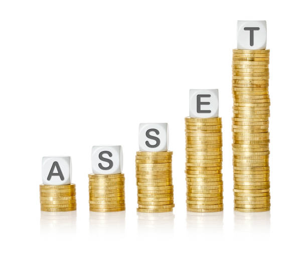 istock Golden coin stacks with letter dice - Asset 1220918662