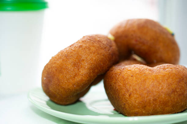 istock Three delicious donuts on a green saucer. 1220920357