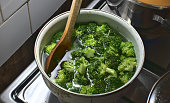 Wooden spoon inside a fresh green broccoli soup, healthy living, green vegetables