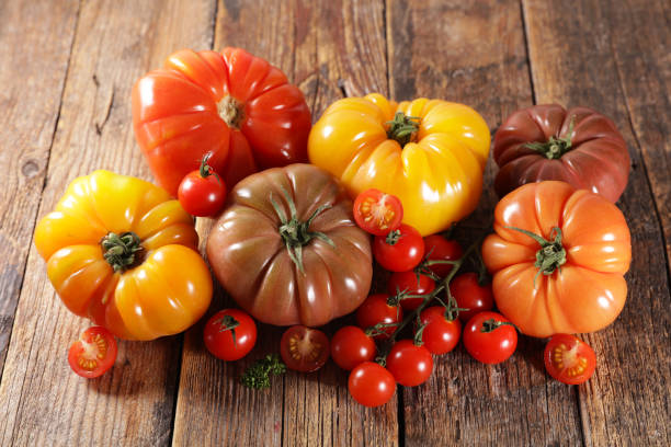 istock colorful tomatoes on wood background 1220920947