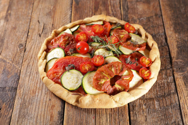istock vegetable quiche with rosemary on wood background 1220920956