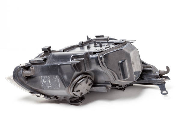 istock Black plastic spare part auto on a white background - rear view xenon headlight with a closed lid inside. Equipment for sale for car repair in service. 1220922918