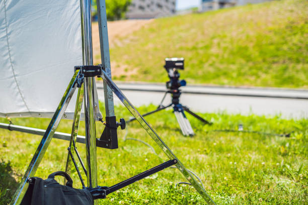 istock Grip team, light depurtment members prepare the lighting equipment before shooting 1220923448