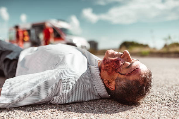 istock man lying down on the ground after the injury 1220924490