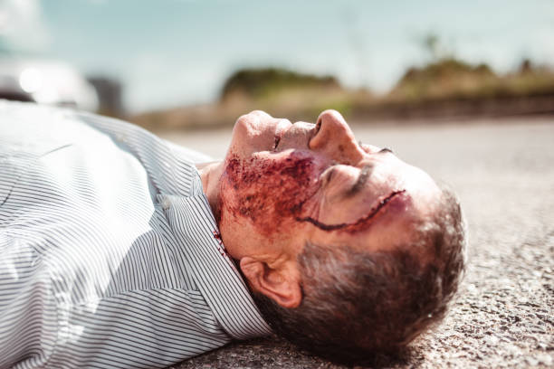 istock man lying down on the ground after the injury 1220924511