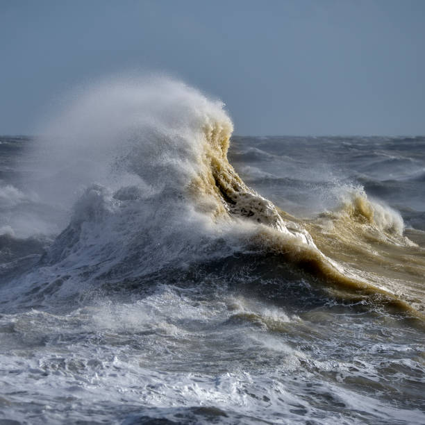 istock Amzing image of individual wave breaking and cresting during violent windy storm with superb wave detail 1220924514