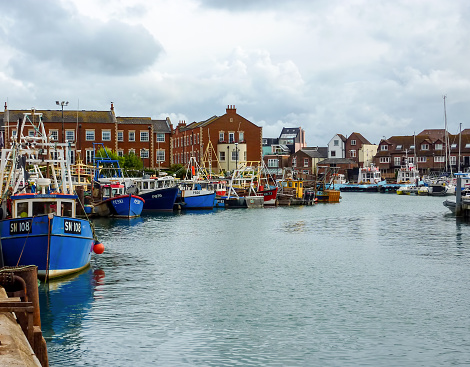 Portsmouth, UK - July 07 2011: Fishing boats docked in Camber dock