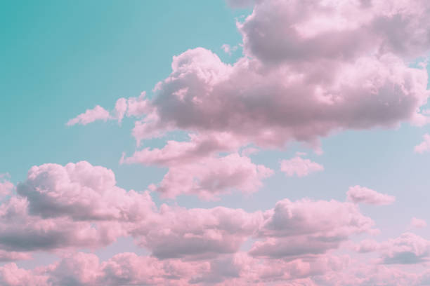 Aesthetic background with beautiful turquoise sky with pink clouds and circle light frame. Minimal creative concept of angel paradise stock photo
