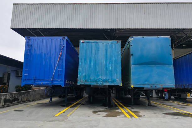 istock Container box docked at warehouse to load and unload goods for delivery 1220929499