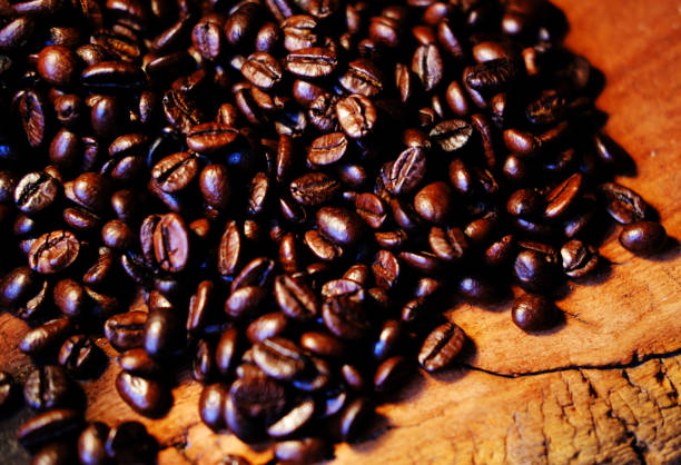 istock Coffee beans on wooden background 1220933317