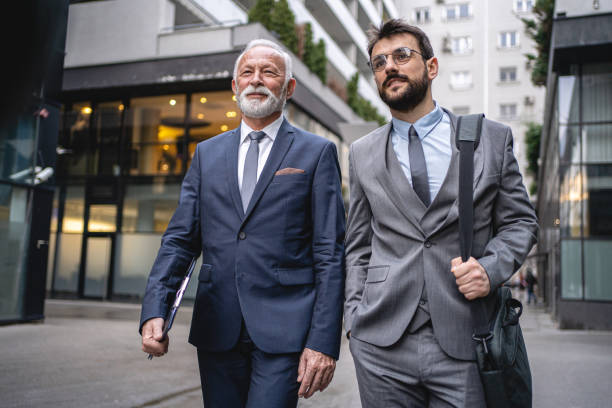 istock Two businessmen are walking confidently to the office 1220935760