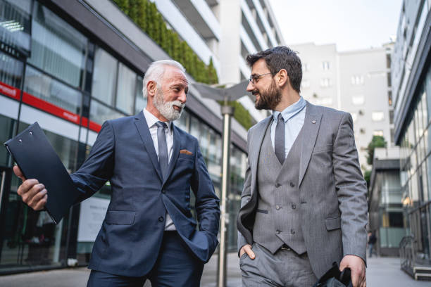 istock Business colleagues chitchat on the way to work 1220937191