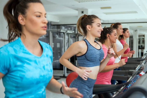 istock Women running on treadmills 1220939533