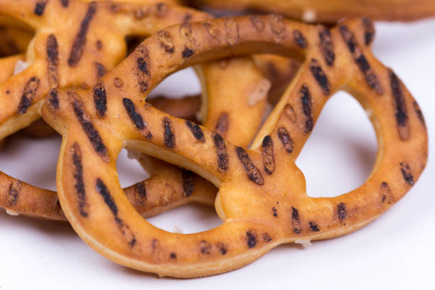 istock Close macro view of pretzels over white background 1220940887