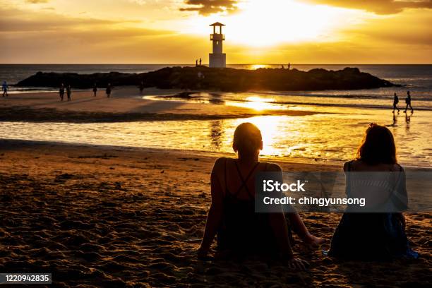 Phuket Thailand February 12 2020summer Landscape With Young Caucasian Tourist Friend Watching Golden Sunset On Tropical Khao Lak Beach In Phang Nga In Thailand Stock Photo - Download Image Now