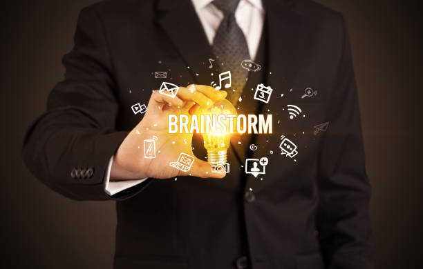istock Businessman holding a light bulb, social media concept 1220943295