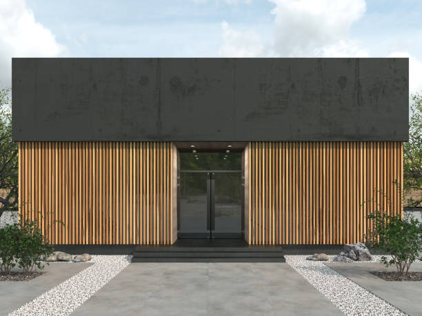 Modern building in loft style of a rectangular shape with flat roof. Facade with a glass entrance doors and wooden battens walls. Copy space. Place for logo. 3D rendering.