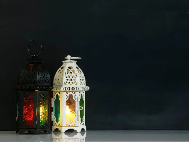 Two islam design of lanterns  in front of blackboard
