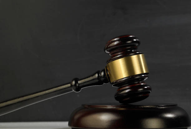istock judge hammer and gavel against blackboard 1220949352