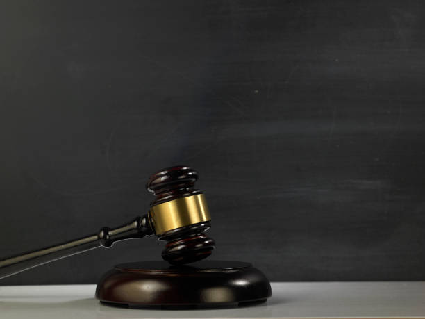 istock judge hammer and gavel against blackboard 1220949842