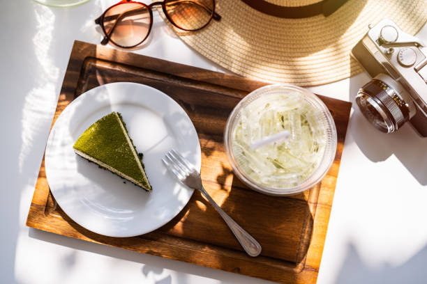 Dessert and drinks with travel items on the table