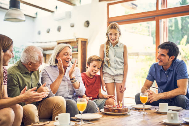 istock Happy family celebrating birthday at home 1220952000