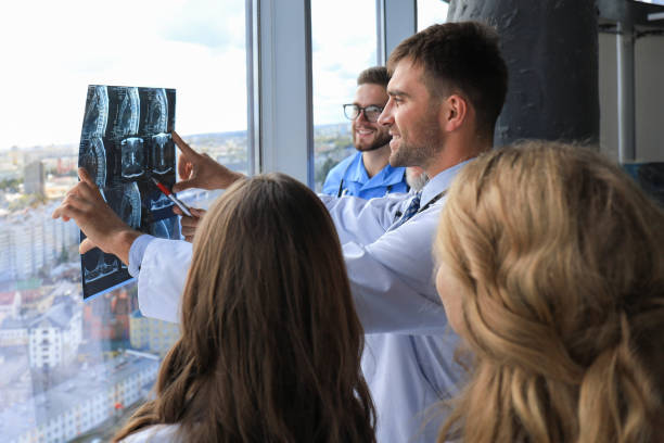 istock Group of doctors checking x-rays in a hospital. 1220952049