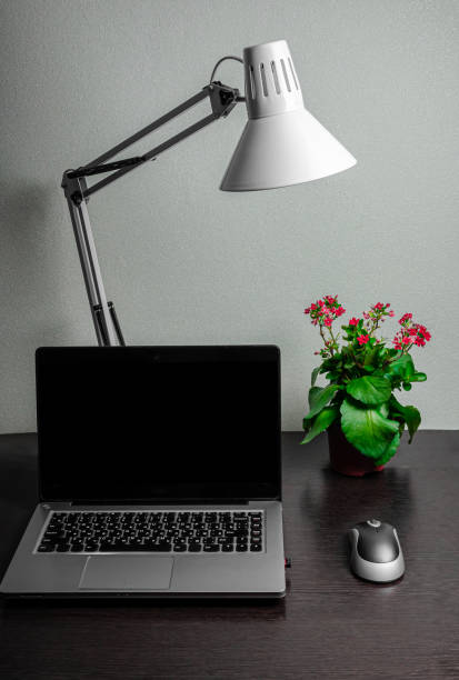 istock laptop notepad pen legs phone home work remotely comfort 1220954908