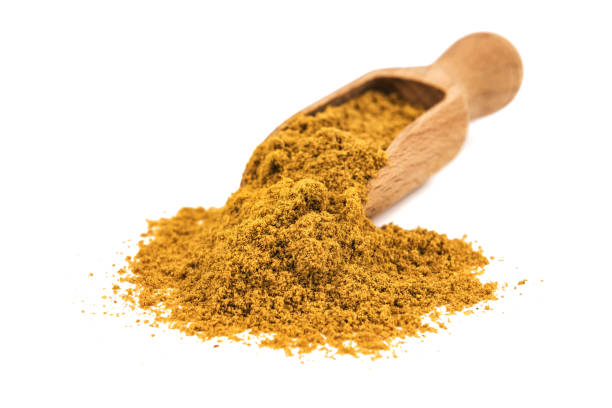 istock curry powder with wooden spoon 1220958265