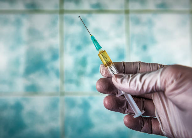 istock injection with medication in the hand 1220958417