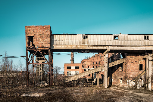 destroyed old conveyor at an abandoned ruined factory