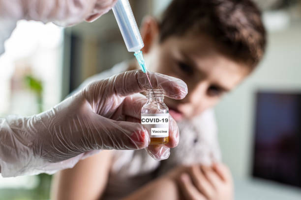 istock Little boy waiting to be vaccinated from Covid-19 1220960134