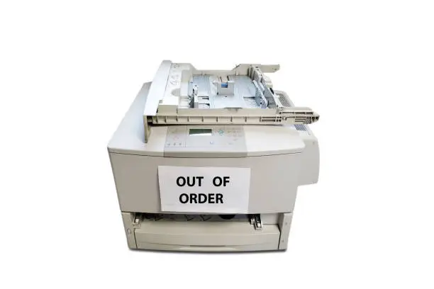 Photo of Obsolete degraded office copier on white background