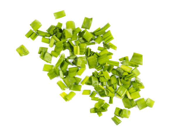 istock Stretched bunch of green onion isolated on white, macro 1220967275