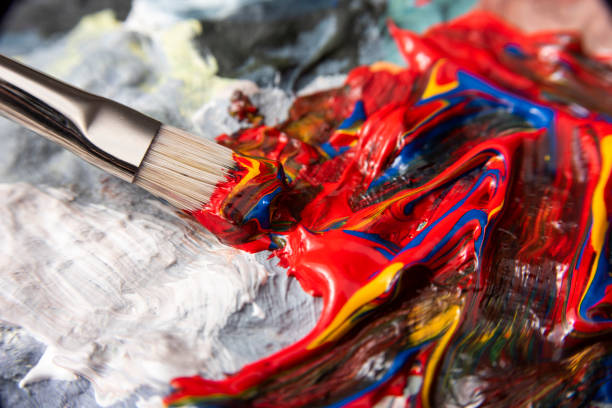 istock Mixing paint on the painting palette 1220968813