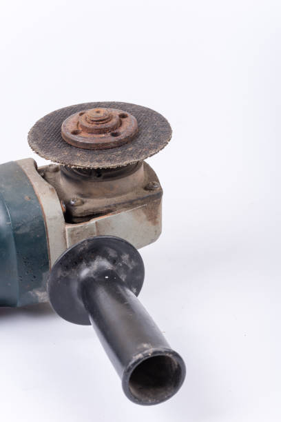 istock Old used rusty grinder round knife over white background 1220968918