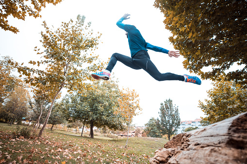 Professional athlete jogging in park