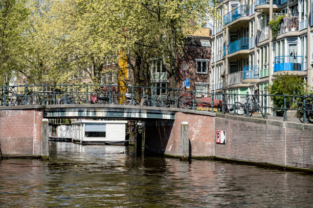 istock Bicycles parked beside an Amsterdam canal 1220971513