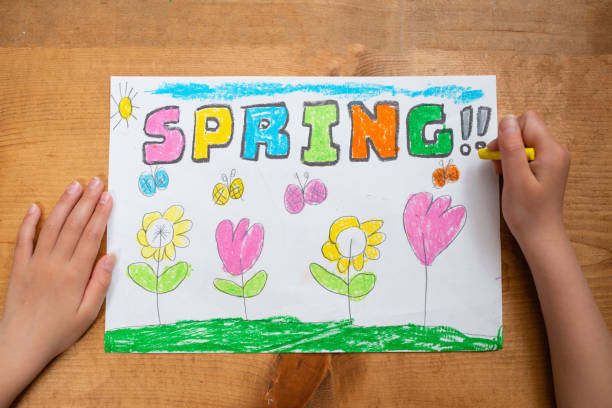 istock Children's hand drawing with SPRING on paper 1220972149