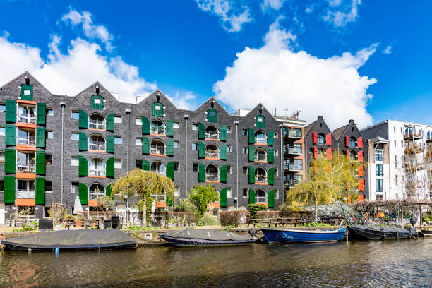 istock Canal houses with green shutters in Amsterdam 1220972449