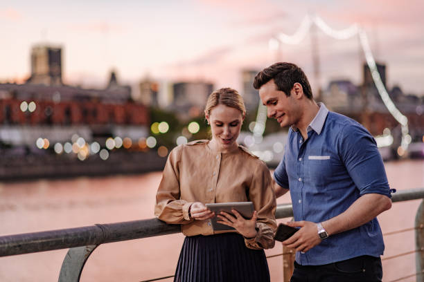 istock Business people in Latin America looking at digital tablet 1220973084