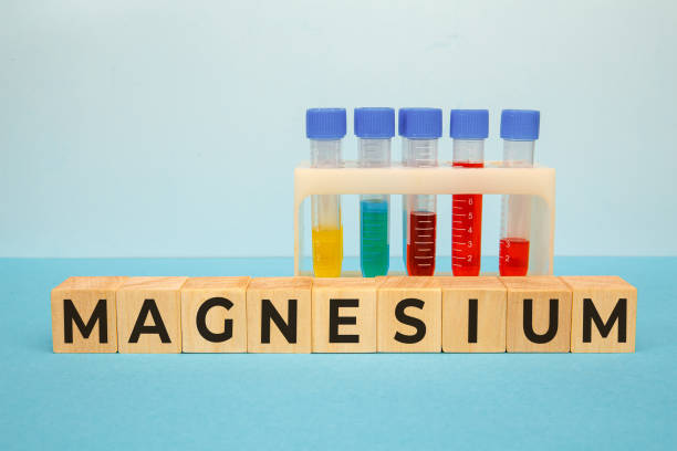 MAGNESIUM word on wooden cubes stock photo
