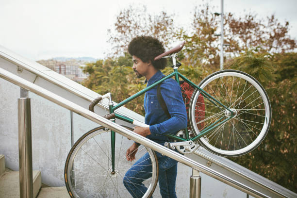 istock Mid Adult Male Bicycle Commuter Returning Home from Work 1220975315