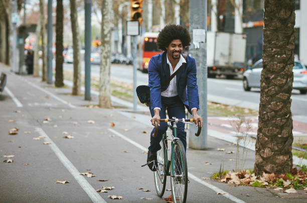 istock Afro-Caribbean Businessman in Early 30s Cycling From Work 1220975328